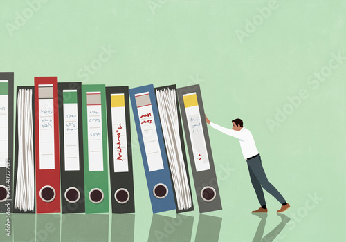 Domino effect - businessman pushing document files against green background