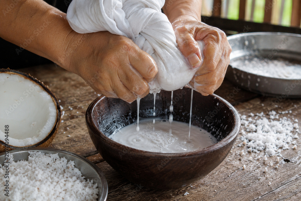 Fototapeta premium Photorealistic Coconut Milk Preparation With Local Cultural Authenticity
