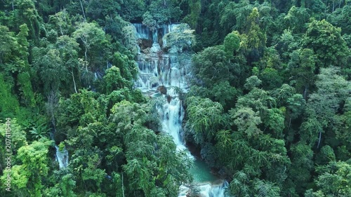 Drone Flight Over Kuang Si Waterfall Surrounded by Tropical Forest