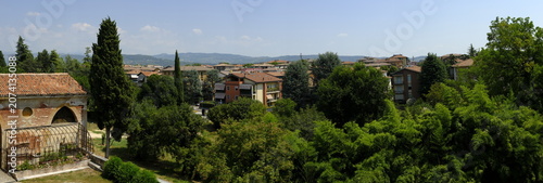 Panoramic view of Verona suburbs with houses and green trees