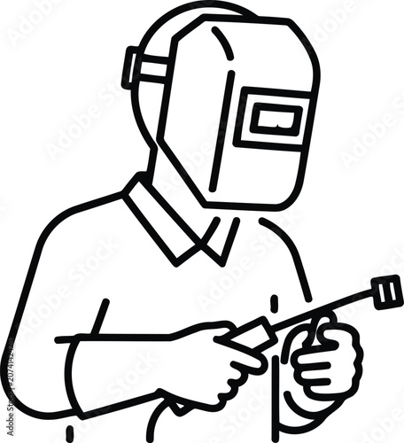Welder wearing a protective mask holding a welding torch