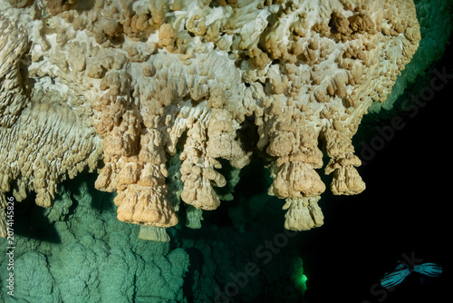 Fotografie Beautiful underwater cenote cave with ancient limestone formations in Mexico