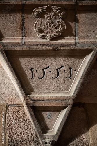 Historic sandstone lintel engraved with the year 1551