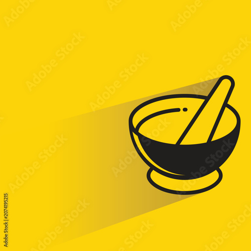 mortar and pestle  icon with shadow on yellow background