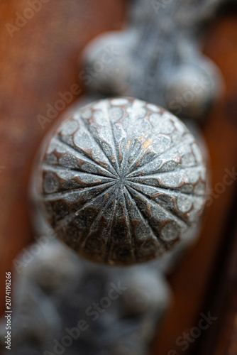 Macro of antique engraved metal door handle detail
