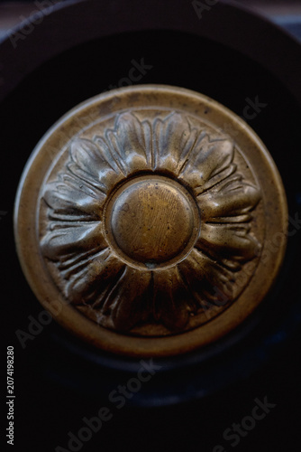Vintage brass door knob with floral ornament