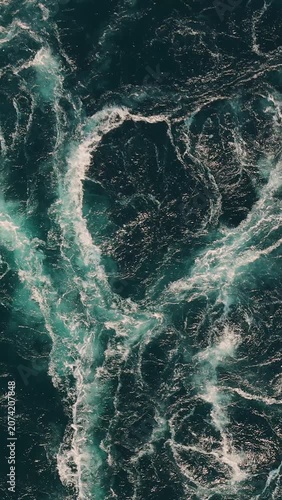 Blue waves of water of the river and the sea meet each other during high tide and low tide.