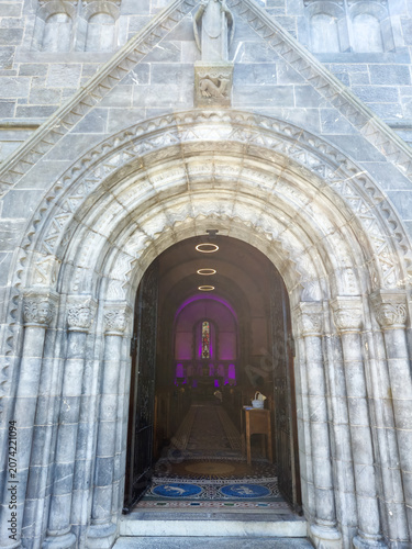 Ornate stone church entrance with arched doorway