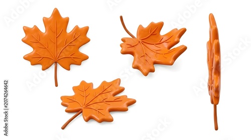 A collection of four stylized orange maple leaves, showcasing different angles and a textured surface, reminiscent of autumn decorations