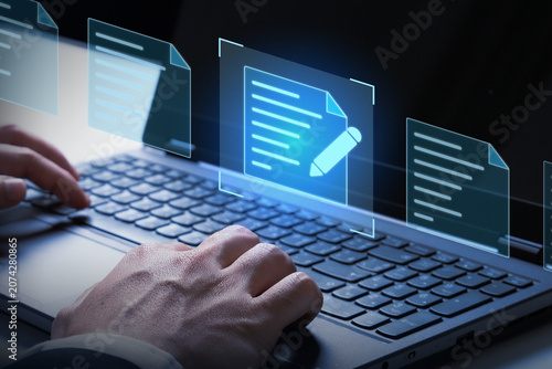Digital Document Workflow: A close-up shot showcases a person's hands typing on a laptop, with holographic documents and a glowing edit icon appearing in the foreground.