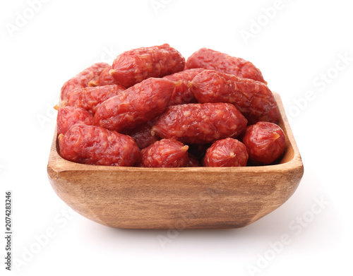 Smoked  mini sausages in wooden bowl