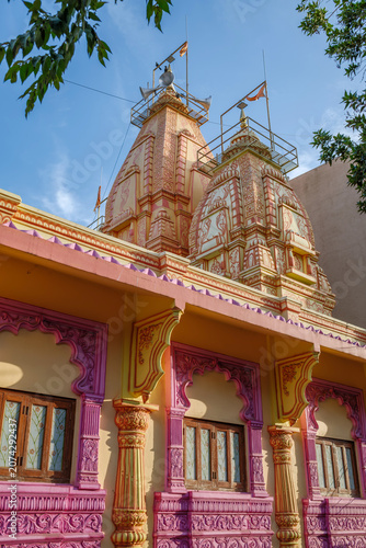 Bilde på lerret An exterior shot of a local Hindu temple in the suburban neighbourhood of Kharadi, showcasing traditional Indian temple architecture, intricate carvings and devotional details