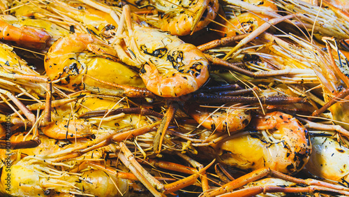 Slika na platnu Full frame background of roasted giant freshwater prawns, delicious orange seafood buffet display