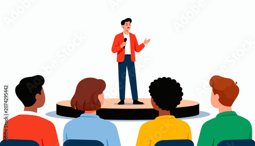 Man stands on stage, addressing an engaged audience