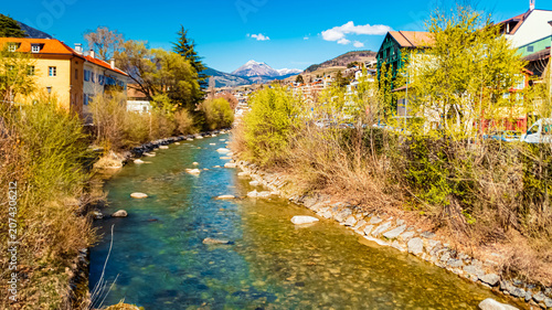 Foto Alpine spring view with a river at Brixen, Bressanone, Eisack valley, South Tyro