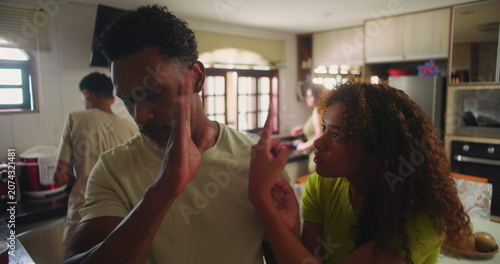 Konstfotografi Father dismissing teenage daughter's plea with hands raised in frustration, high