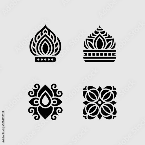 Set of four black ornamental vector icons on a gray background