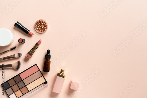 Make up products. Shadow palette with brushes, lipstick, cream and others.