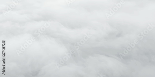 Konstfotografi Vast White Clouds: An aerial view captures an endless expanse of soft, billowing white clouds, creating a serene and ethereal atmosphere above the earth