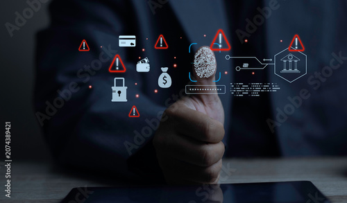 Foto Businessman scanning thumbprint with virtual biometric fraud and bank hack warning icons on tablet