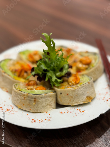 fresh wrap rolls sliced on white plate restaurant style