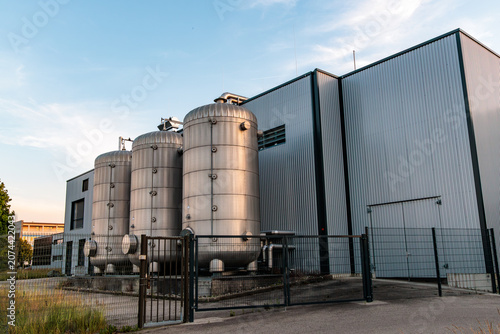Tableau sur toile Modern power to heat industrial facility with large stainless steel storage tanks, local microgrid thermal energy storage concept in Germany