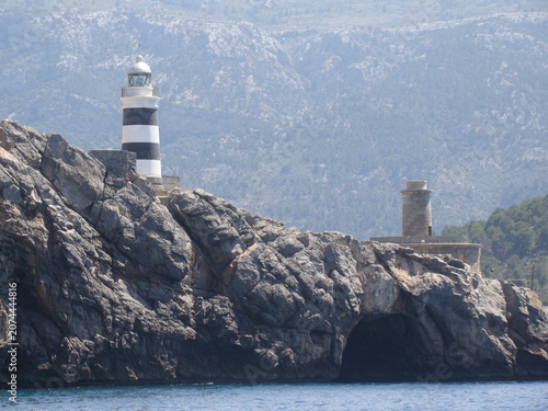 Schilderij op canvas Beautiful shot of a lighthouse, taken on the Balearic Islands, during a lovely summer day
