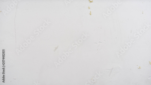 Foto Texture of an old white painted wall with minor scratches and stains