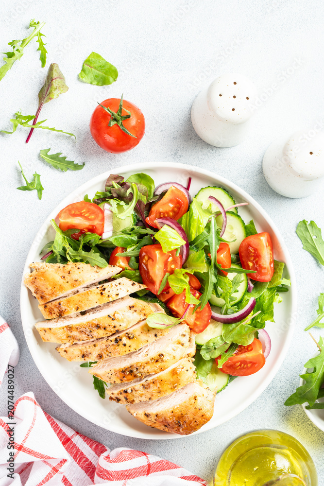 Fototapeta premium Green salad with leaves, tomatoes, cucumber.