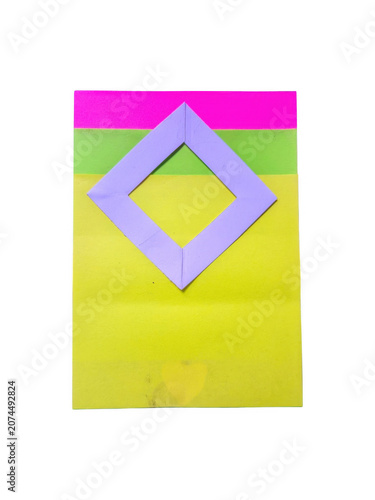 Purple diamond shape made of paper on colorful stacked layers isolated on transparent background