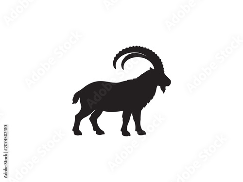 Black silhouette of an ibex goat with long curved horns silhouette wildlife mountain