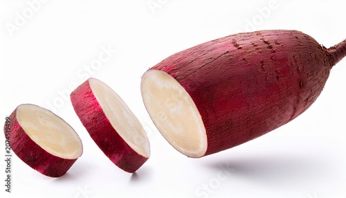 Whole And Sliced Beatroot Floating On Thr White Background