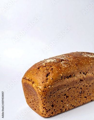 Fresh Brown Bread Loaf Resting on Clean White Background