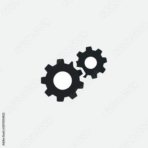 Two Black Gear Shapes Against A Light Gray Background