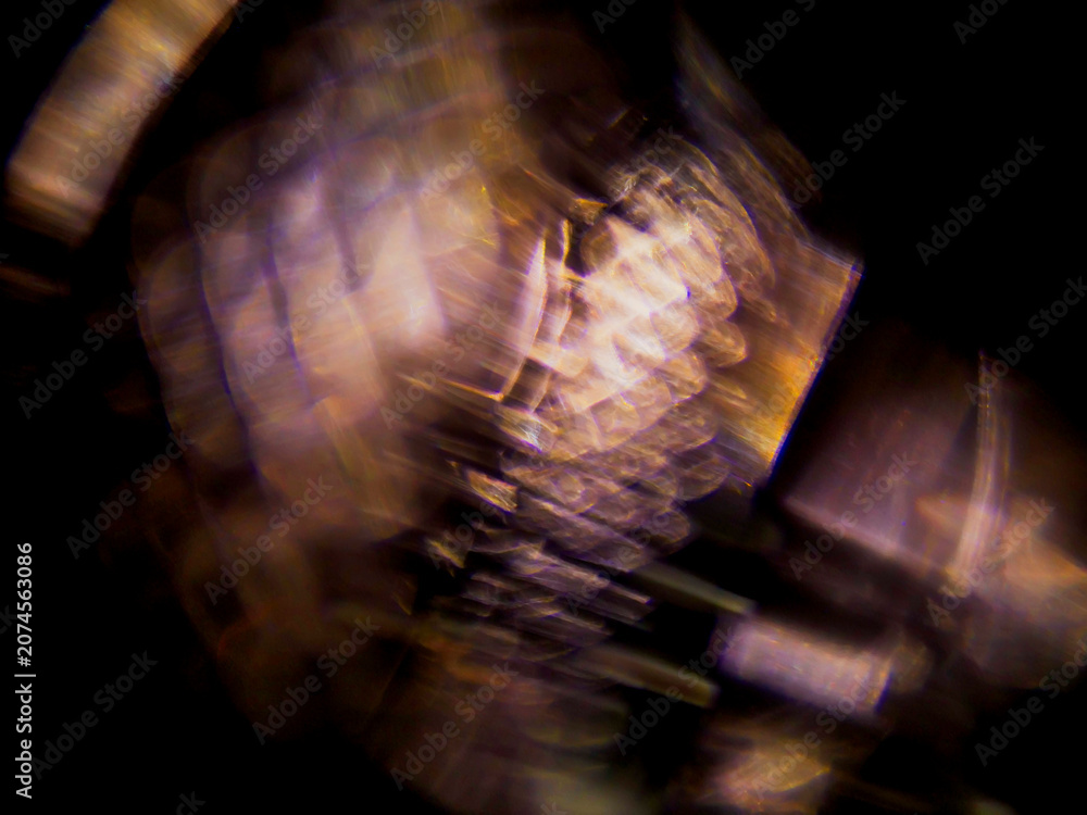 Fototapeta premium Abstract blurred image of colorful light patterns. Dark background with glowing blue and orange hues. Focus is soft, creating a dreamy, atmospheric effect. Good for design and special effects.