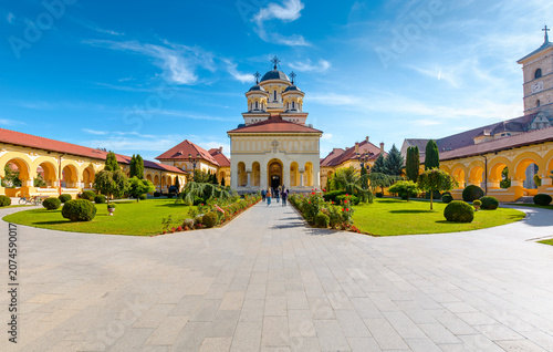 alba iulia, romania - 13 oct 2019: coronation cathedral. holy trinity romanian orthodox cathedral located in alba iulia citadel. sunny autumn day. popular travel destination in europe