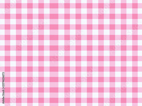 Close-up view of a neat, baby pink gingham pattern on a white background - AI-Generated