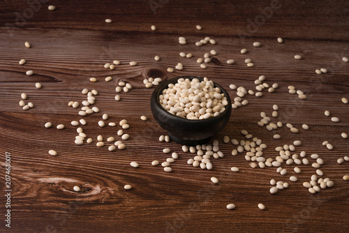 White beans in a wooden bowl