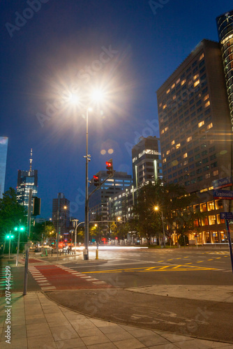 A street lamp illuminating a street in the center of Warsaw