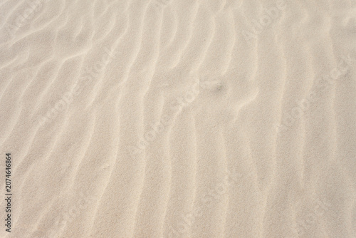 Sandy patterns created by the wind from the sand on the beach