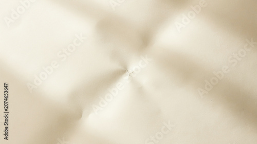 Soft beige fabric texture, tufted close-up, cream colored material, leather-like background