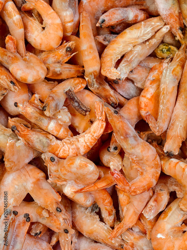 Supermarket freezer filled with fresh frozen prawns ready to buy