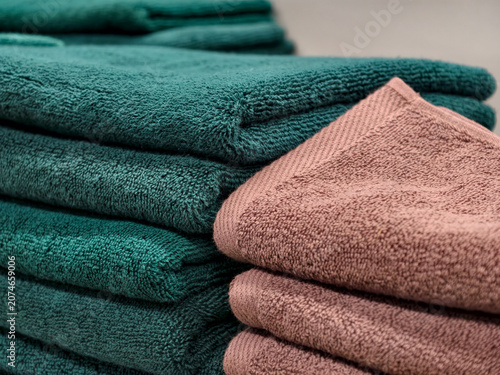 Turquoise and brown towels arranged neatly on home essentials display