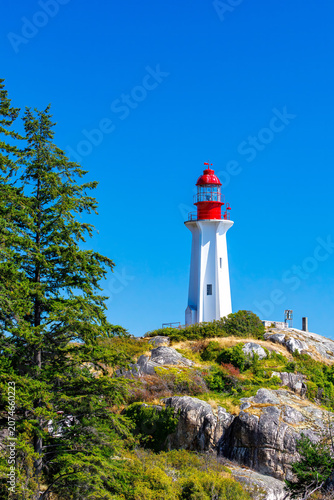 Photos colorful lighthouse on the rocky coast of British Columbia