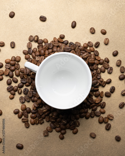Coffee preparation concept with empty cup and roasted beans