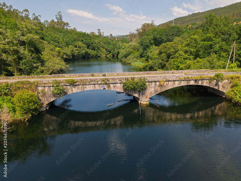Fototapeta premium Galicia rural stone bridge crossing river
