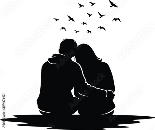 Silhouette of loving couple sitting together
