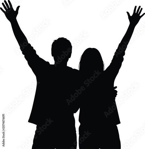 Silhouette of a man and woman celebrating