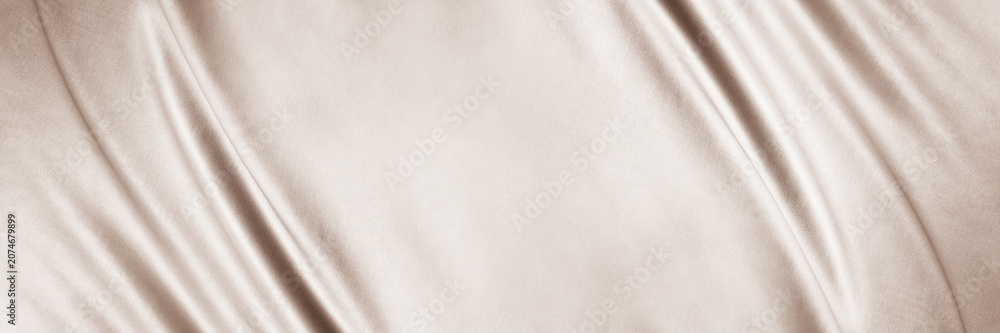 Fototapeta premium Light brown beige textile fabric. Elegant luxury background. Soft folds, curved lines. Nude pastel. Beauty branding fashion wedding. Premium cosmetic design. Empty template. Flat lay, table top view.