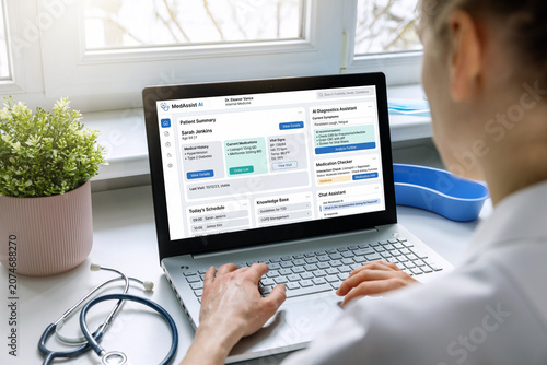 Female doctor using medical AI assistant on laptop computer in clinic office. modern medicine